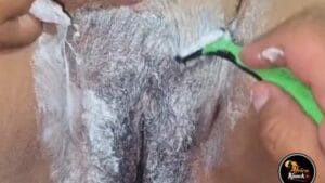 Her man is shaving her pussy clean on a closeup